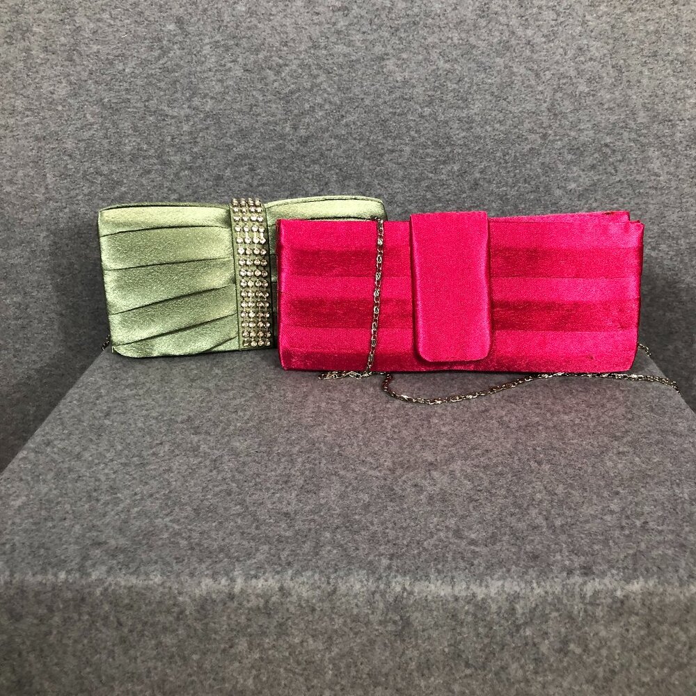 Set of women's fabric covered evening clutches: One magenta, one green.